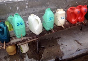 Home-made taps out of plastic containers and wooden stopper. This school in Bhutan  encourages hand washing during recess but had shortage of taps. They made these gadgets and parent volunteers filled it with water before recess so kids can line up to open the wooden stopper to wash hands.